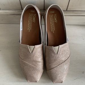 Toms size 6.5 ladies shoes. Gold glitter upper. Beautiful and ready to be loved.